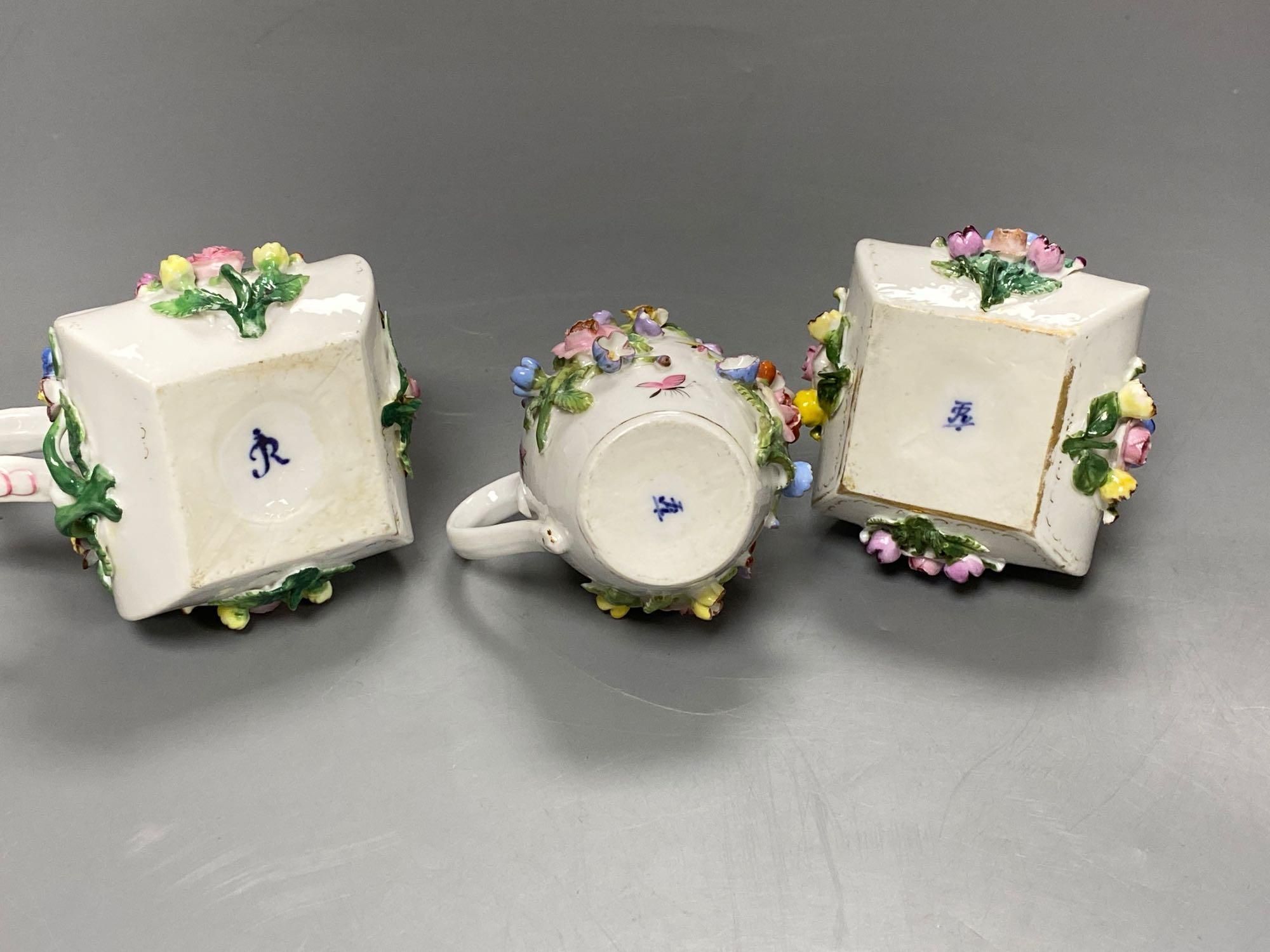 A late 19th century French porcelain flower encrusted cafe au lait set, on stand, stand 27cm